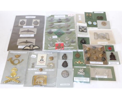 The Durham Light Infantry :- a collection of cap badges, buttons, embroidered cloth shoulder titles, pair of cuff-links etc; 