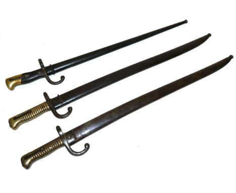 A French M1866 Chassepot Yataghan Sword Bayonet, the back edge of the blade engraved Mre. d'Armes de Chat., the brass hilt wi