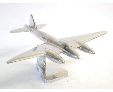 A Cast White Metal Model of a De Havilland Mosquito, on a shaped pillar and triangular base, 39 cm long, 24 cm highOverall co