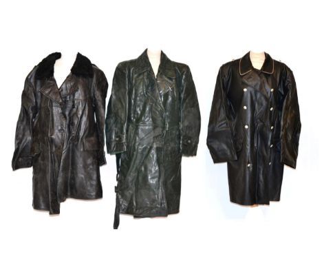 A German Navy Black Leather Double Breasted Coat, with astrakan collar and grey wool lining; a German Green Leather Coat, wit