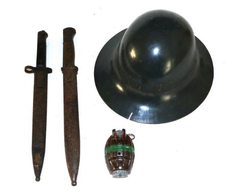 A Collection of Militaria, comprising a Brodie helmet, painted grey, stamped ''M'' to the brim underside, the leather-covered