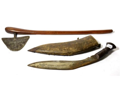 A Shona Axe, with rounded triangular shape blade, the tang inserted into the swollen pommel of the tapered curved haft, the b