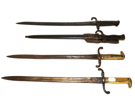 Two Prussian M1871 Sword Bayonets, each with brass hilt, one side with diagonal grooves, the opposing side smooth, one lacks 