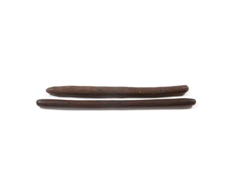 Two 19th Century Australian Aboriginal Waddies, possibly Queensland, each of rounded cylindrical form and of dense hard wood 