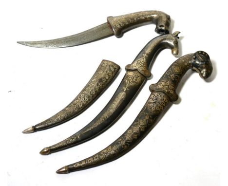 Three Indian Small Daggers, each with faux damascined curved steel blade, the hilt modelled as an animal, with scabbard, all 