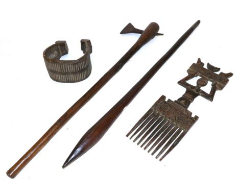 A 19th Century Australian Aboriginal War Club, with pointed ovoid head and tapering haft with scale carved pointed butt, 69.5