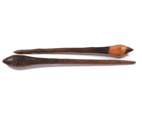 Two 19th Century Australian Aboriginal Clubs, each with pointed ovoid head and tapering haft with pointed butt, of dark rich 