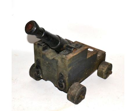 A Cast Iron Model of a Signal Cannon, the 45.5 cm ringed barrel cast with a rose adjacent to the touch hole, with spherical c