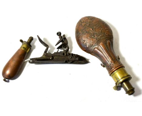 A Copper Powder Flask, embossed with leaves and fluting, the brass charger with internal spring, later stamped Sykes Patent; 