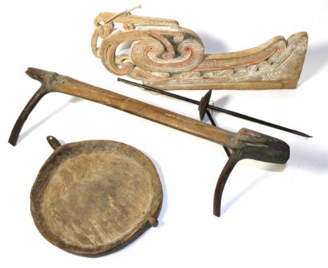 A Trobriand Islands Canoe Prow, of light wood pierced and carved with sinuous forms highlighted in white, black and red pigme