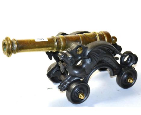 A Non-Working Model of a Signal Cannon, the 35cm ringed barrel with globular cascabel and cylindrical trunnions, on a black c
