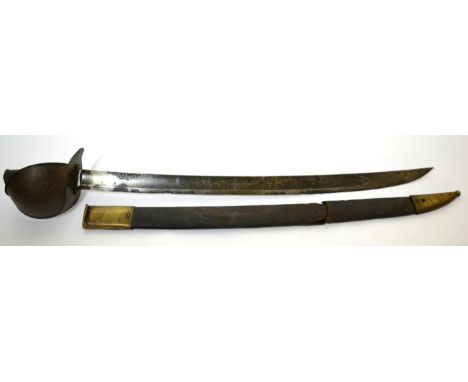 A French M1833 Naval Cutlass, the 67.5cm single edge broad curved fullered blade bearing traces of an engraved fouled anchor,