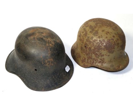 A German Third Reich M1940 Army Helmet, with desert camouflage, the left inner brim stamped SE64, the back inner brim stamped