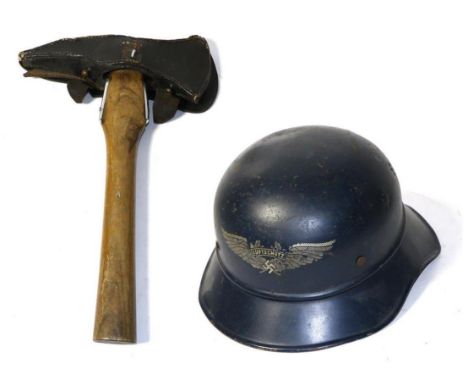 A German Fire Service Presentation Axe, the chromed steel head stamped ''Fur 40 Jahre treue Dienste Frw.Feuerwehr Upen'', wit