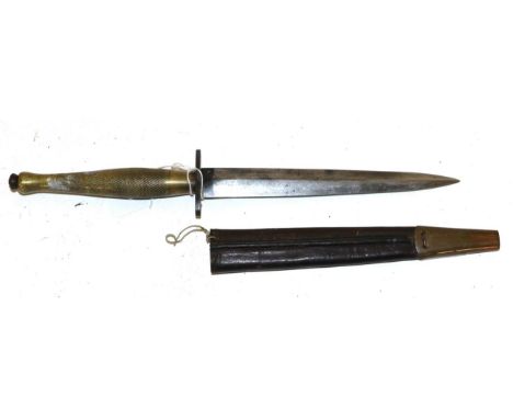 A Fairbairn-Sykes Fighting Knife, Second Pattern, the drop-forged steel blade unmarked, the crossguard stamped broad arrow an