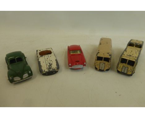 DINKY TOYS - an early post-war model of a Studebaker, two coaches and a Cunningham; also a Corgi model of an Aston Martin DB4