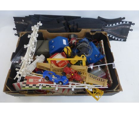 A quantity of Scalextric including cars, accessories, triggers and track.