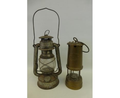 A hand held paraffin lantern, a Lamp & Limelight Company Hockley miner's lamp colliery No. 8781 serial no. 13755, an AA car b