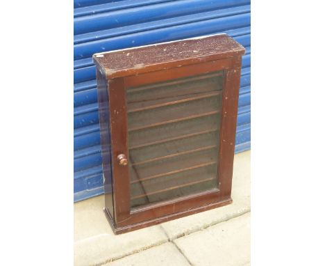 A wall hanging glass fronted model display cabinet.