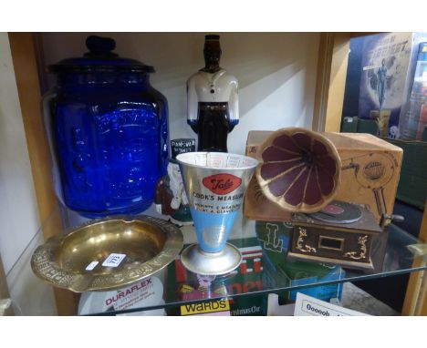 A large Philips Lamps brass ashtray, a conical cook's measure, a Barbados Rum glass decanter and a boxed "Supreme" hairdryer 