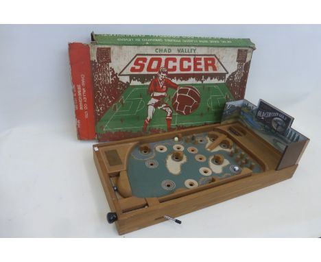 A boxed Chad Valley Co. Ltd soccer game, and a golf related pinball machine.