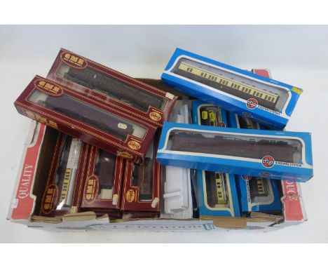 A box of Airfix and G.M.R. Airfix 00 gauge model railway items including two tank locomotives, carriages etc, mostly boxed.