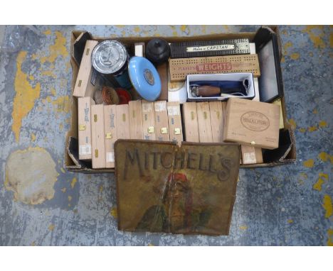 A box of assorted cigarette related advertising and packaging including a bakelite cribbage board and a Showmans tobacco card