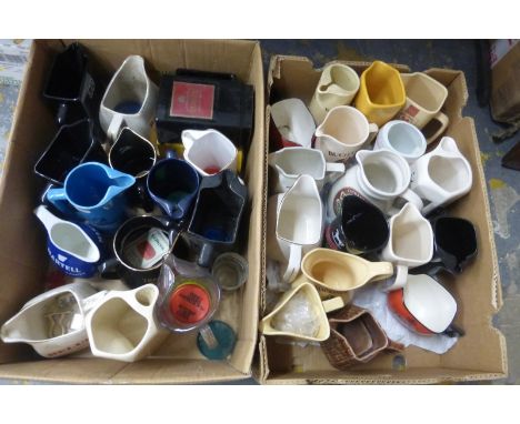 Two boxes of brewery advertising ceramic jars.