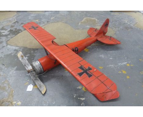 A decorative model of a German WWI fighter bi-plane.