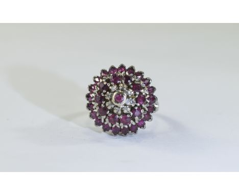 14ct gold ruby and diamond cluster ring, high mount set with alternating rows of round and marquise cut rubies with single ro