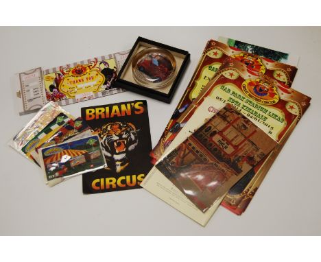 A collection of circus related items, to include leaflets, ephemera, photographs, BT phone cards, a ticket book and a paperwe