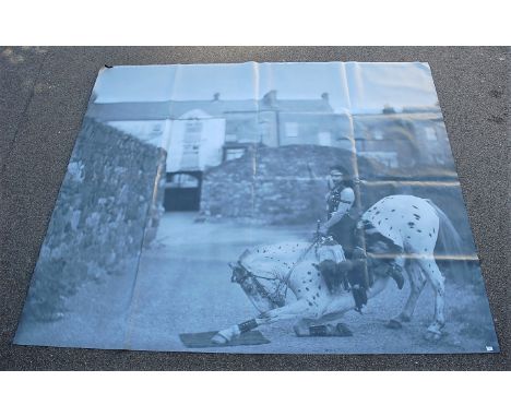 A large monochrome photograph print on canvas depicting a circus performer on horseback, unframed, 220 x 260cm