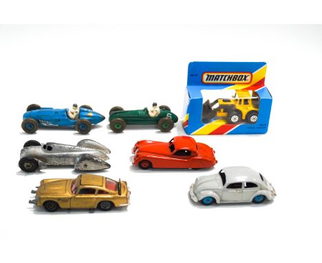 Six Dinky die-cast vehicles, including a Cooper-Bristol racing car, a Talbot Lago racing car, a James Bond DB5 Aston Martin, 