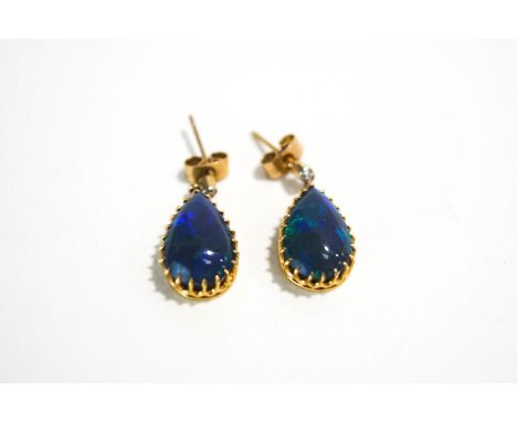 A pair of black Opal and diamond drop earrings, the tear shaped cabochons approximately 13.4mm long, with an old single cut d