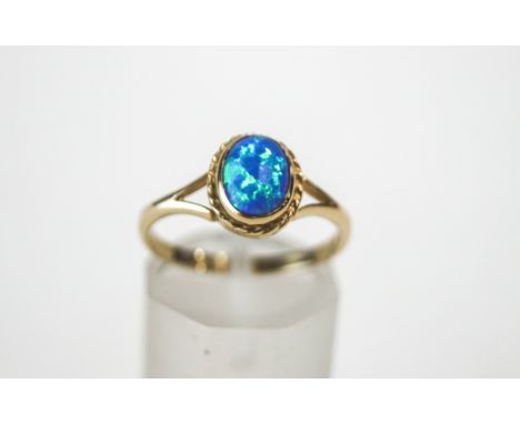 A 9 carat gold synthetic opal ring, finger size N, 1.8 g gross