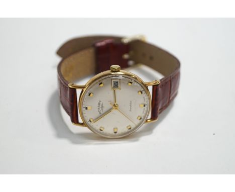 Rotary, a 9 carat gold gentleman's wrist watch, the circular white dial with glt batons, hands, centre seconds hand and date 