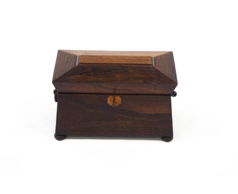A 19th Century rosewood tea caddy, of sarcophagus form, on turned bun feet, 34cm wide