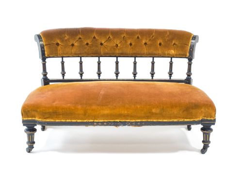  A Victorian ebonised and button back settee, 250cm wide