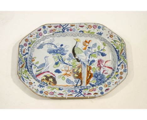 A mid 19th Century Ashworth pottery meat dish, decorated with exotic birds among flowers, 43cm wide