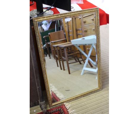 A GILT FRAMED RECTANGULAR BEVEL PLATE WALL MIRROR 