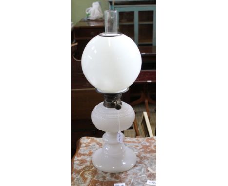 AN EDWARDIAN WHITE OPALINE GLASS OIL LAMP, with chimney and globe shade 