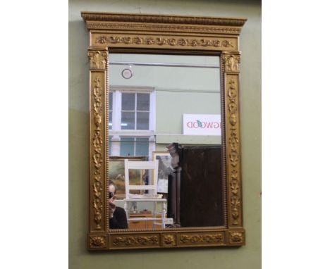 A CLASSICALLY GILT FRAMED RECTANGULAR PLAIN PLATE WALL MIRROR 