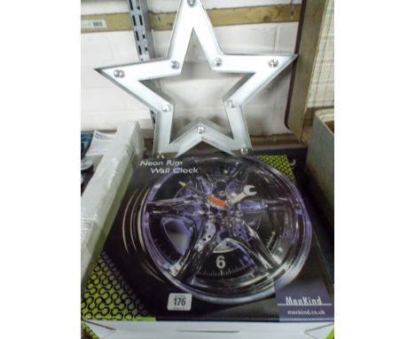 A neon rim wall clock and a triangular shaped wall light 