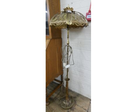 A modern decorative brass fished standard lamp with shade 