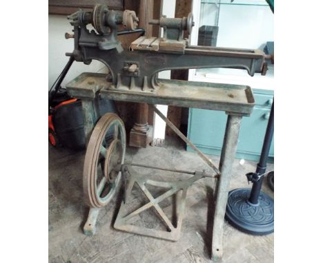 An early Drummond 3.5 inch flat bed metal workers lathe with treadle base made by Drummond Brothers of Guildford Surrey. Circ