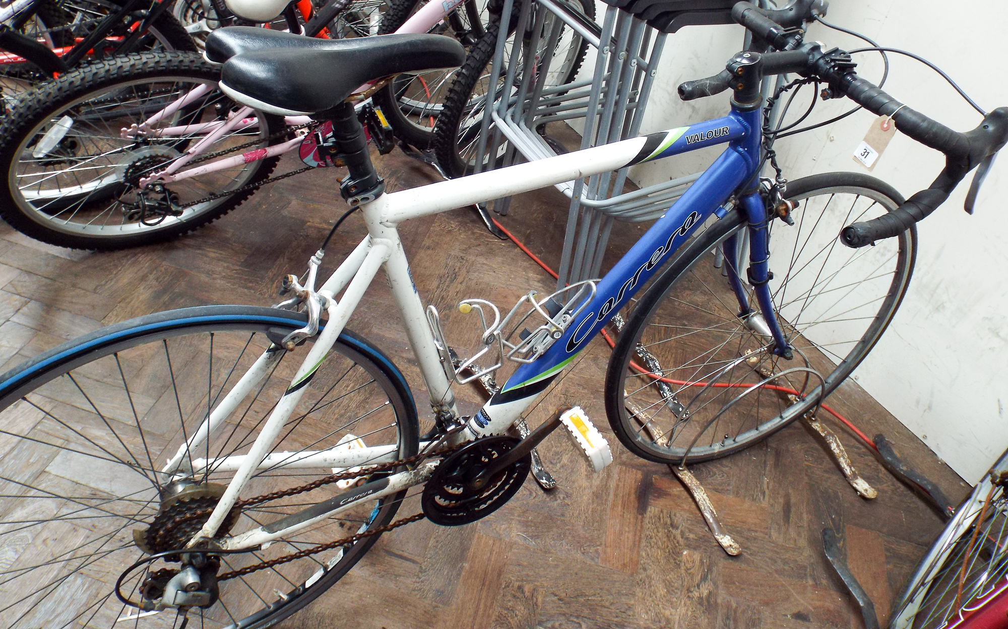 blue and white carrera bike