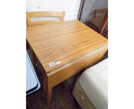 A small formica topped wood effect drop leaf kitchen table and a pair of light beech kitchen chairs 