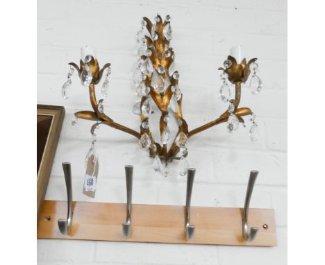 A two branch gilt wall light fitting with glass lustres and a coat hanger 