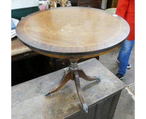 A reproduction mahogany centre pillar tripod coffee table 