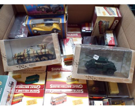 A large box of boxed Great British die cast buses, Old Timer boxed model cars, Eddie Stobart lorries, model tanks etc 